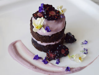 ADAPTOGENIC BLACK TAHINI CAKE WITH BUTTERFLY PEA FLOWER FROSTING